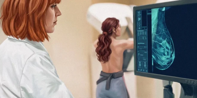 Médica especialista revisando una mamografía en un monitor junto a una paciente.